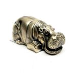 A Russian .88 silver model of a hippo with ruby eyes, 8 x 3.5cm.