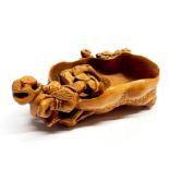 A very finely carved and signed Chinese fruitwood bowl, decorated with a squirrel and insect, L.