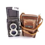 A Ricoh Matic 225 twin lens reflex camera with leather case.