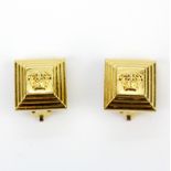 A pair of vintage yellow metal Gianni Versace clip back earrings, L. 1.5cm.