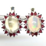 A pair of 925 silver earrings set with cabochon cut opals and rubies, L. 1.5cm.