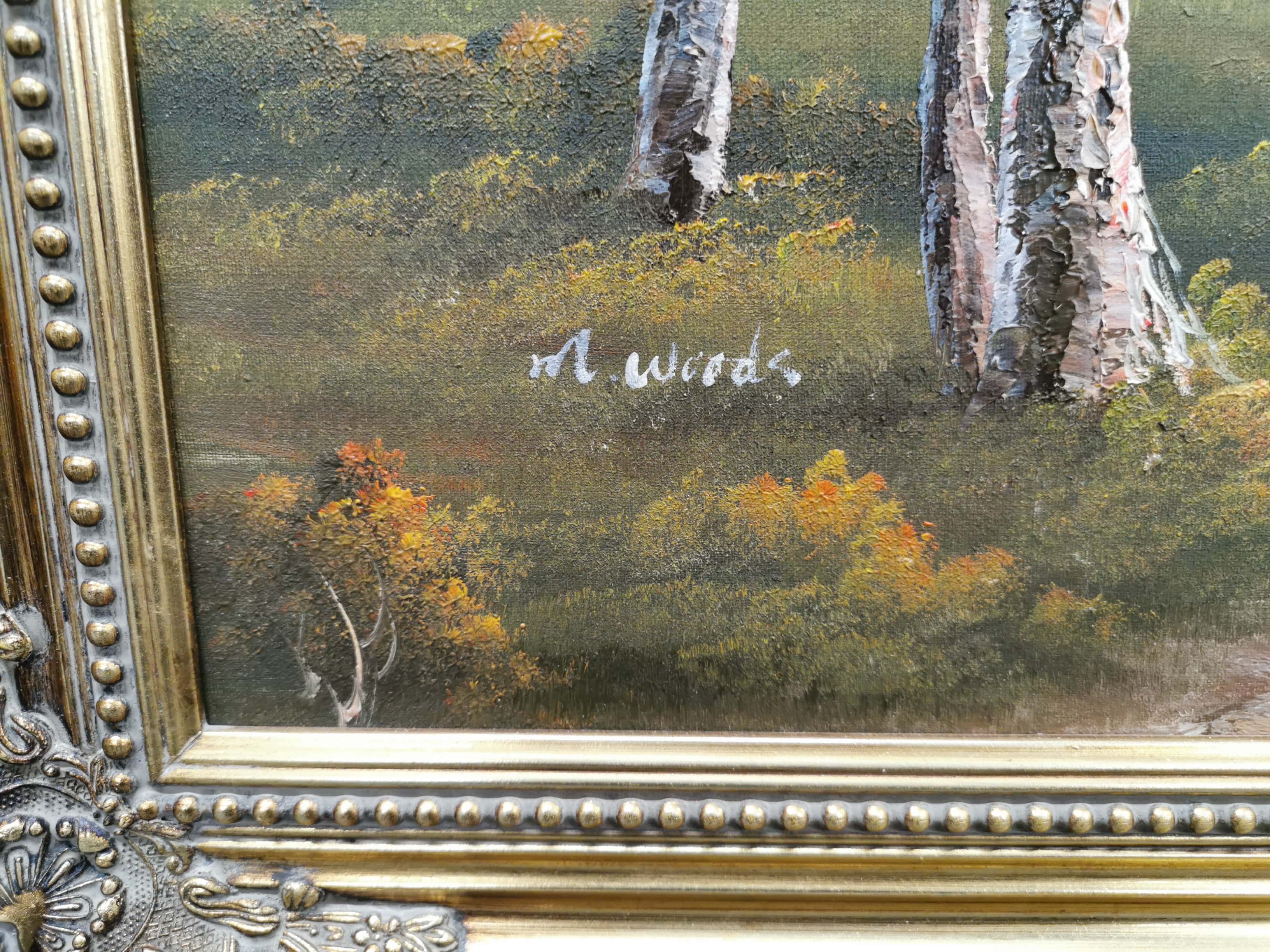 A large gilt framed oil on canvas depicting a lakeside scene, signed M. Woods, frame size 107 x - Image 2 of 2