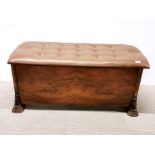 An upholstered 1950's walnut veneered blanket chest, L. 102cm, H. 49cm.