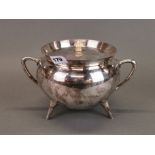 A Christopher Dresser style silver plated cauldron shaped punch bowl and cover, W. 27cm, H. 18cm.