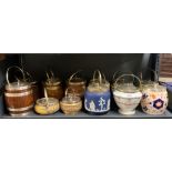 A collection of oak and silver plate and porcelain and silver plate biscuit barrels.