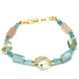 A gold on 925 silver bracelet set with aquamarine and quartz beads, L. 19cm.