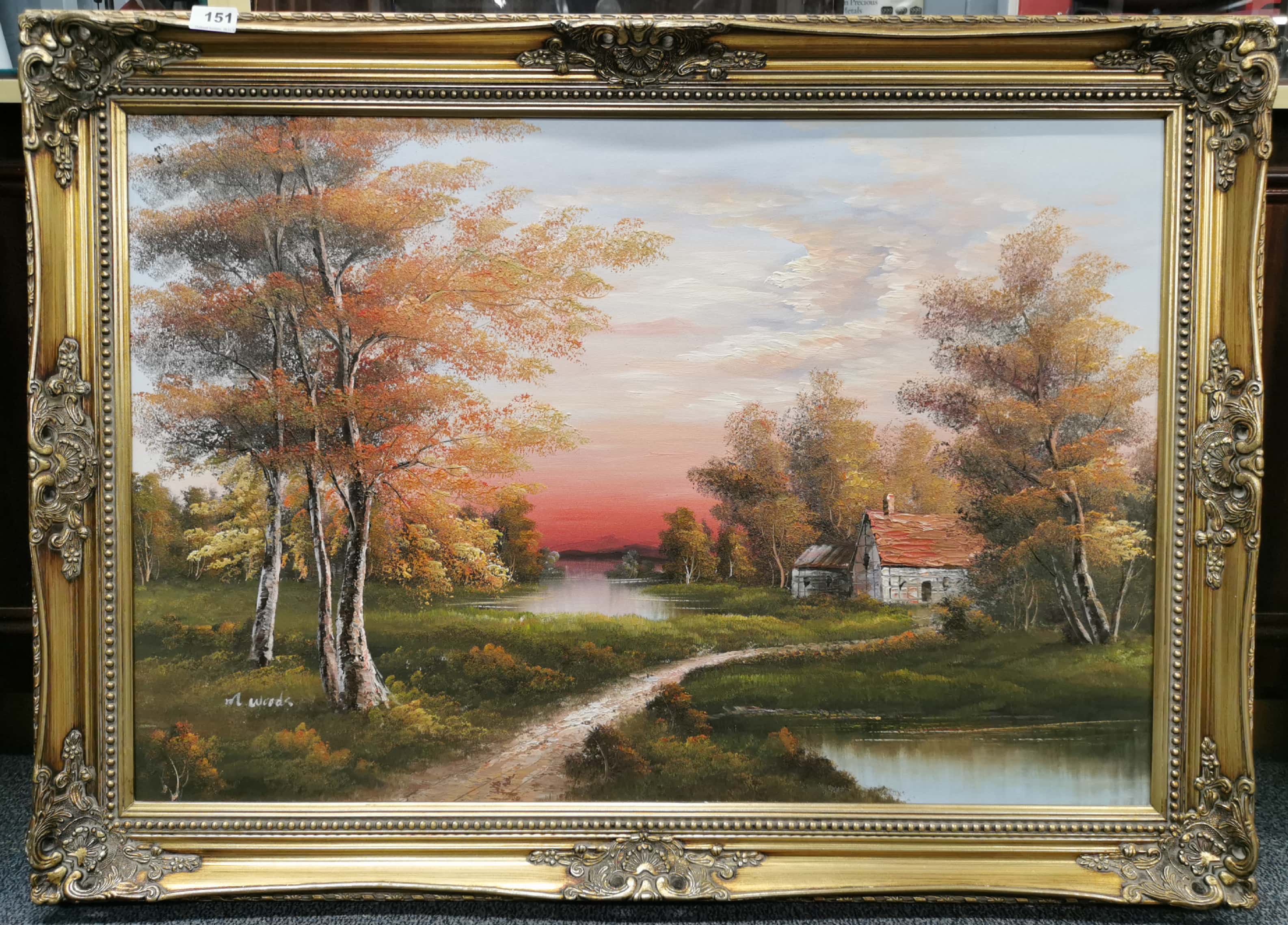 A large gilt framed oil on canvas depicting a lakeside scene, signed M. Woods, frame size 107 x