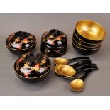 A lovely set of Japanese lacquered and gilt lined bowls and covers with spoons, Dia. 12cm.