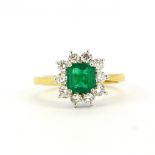 A hallmarked 18ct yellow and white gold ring set with a step cut emerald, approx 0.95ct,