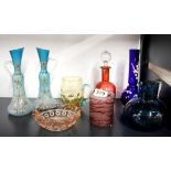 A group of mixed coloured glassware.