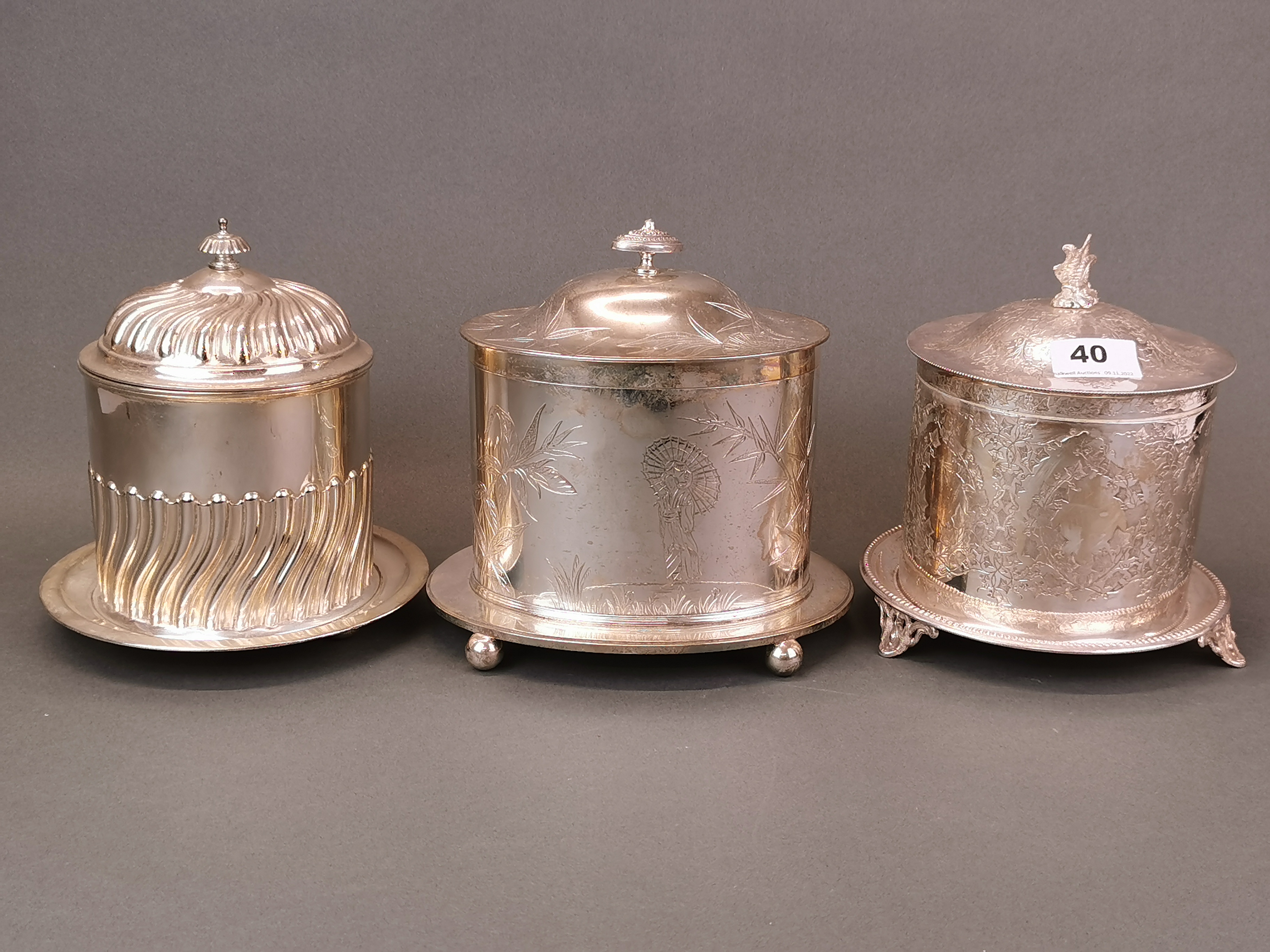 Three antique silver plated biscuit boxes, H. 19cm.