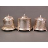 Three antique silver plated biscuit boxes, H. 19cm.