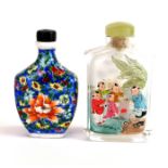 A 1970's Chinese inside painted crystal snuff bottle and a hand enamelled porcelain snuff bottle.