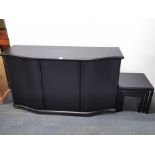 A stylish contemporary black finished three drawer cabinet, 154 x 86cm with a matching nest of three