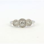 A 950 platinum triple halo ring set with brilliant cut diamonds, H, SI-2, approx. 0.45ct total, (