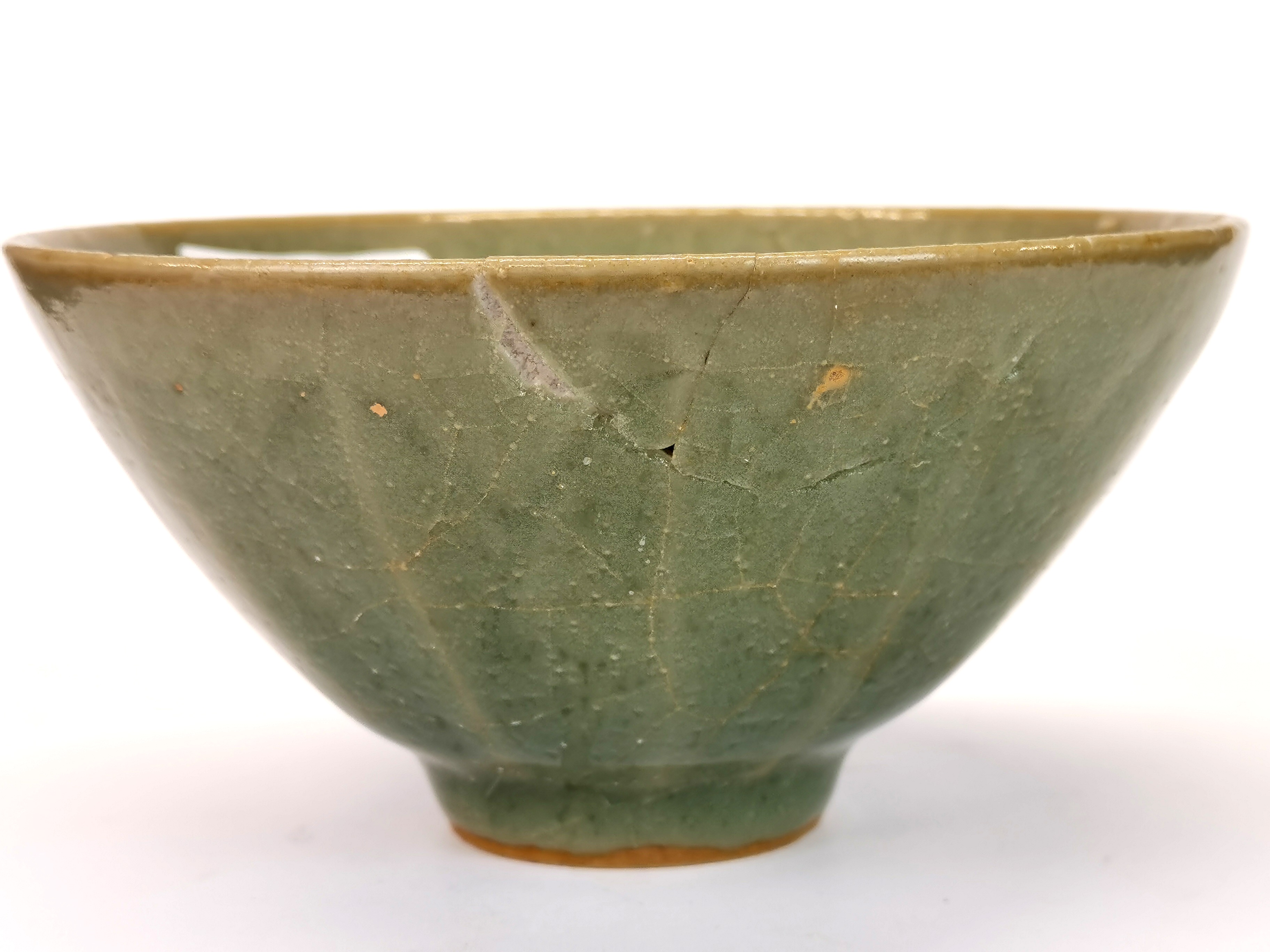 A Chinese celadon crackle glazed lotus bowl, Dia. 14cm, H. 7cm. Slightly A/F. - Image 2 of 3