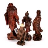 A group of mid 20th century Chinese carved wooden figures (some with glass eyes), tallest H. 25cm.