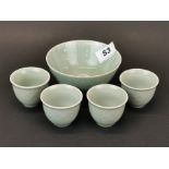 A Chinese celadon glazed rice bowl, Dia. 11.5cm, with group of four tea bowls.