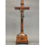 An 18th century bronze and rosewood veneered crucifix, H. 75cm.