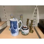 A porcelain jug together with a ginger jar, a pair of porcelain candlesticks