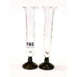 A pair of cut glass bud vases with sterling silver bases, H. 18cm.