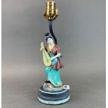 A Chinese porcelain figure mounted as a table lamp, H. 34cm.