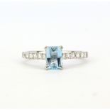 A 950 platinum ring set with an fancy cut aquamarine, approx. 0.97ct, and diamond set shoulders, (