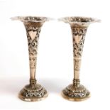 A pair of Eastern hammered white metal bud vases (tested silver) H. 14cm.