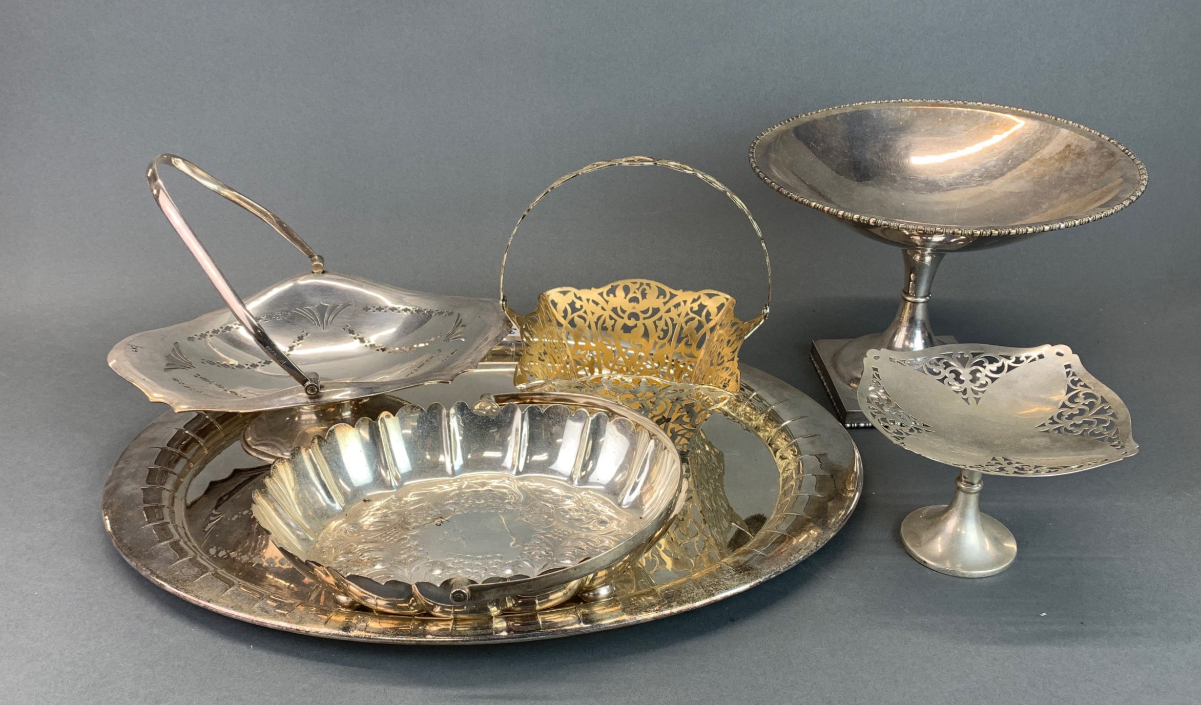 A large silver plated tray, and a group of further silver plated items.