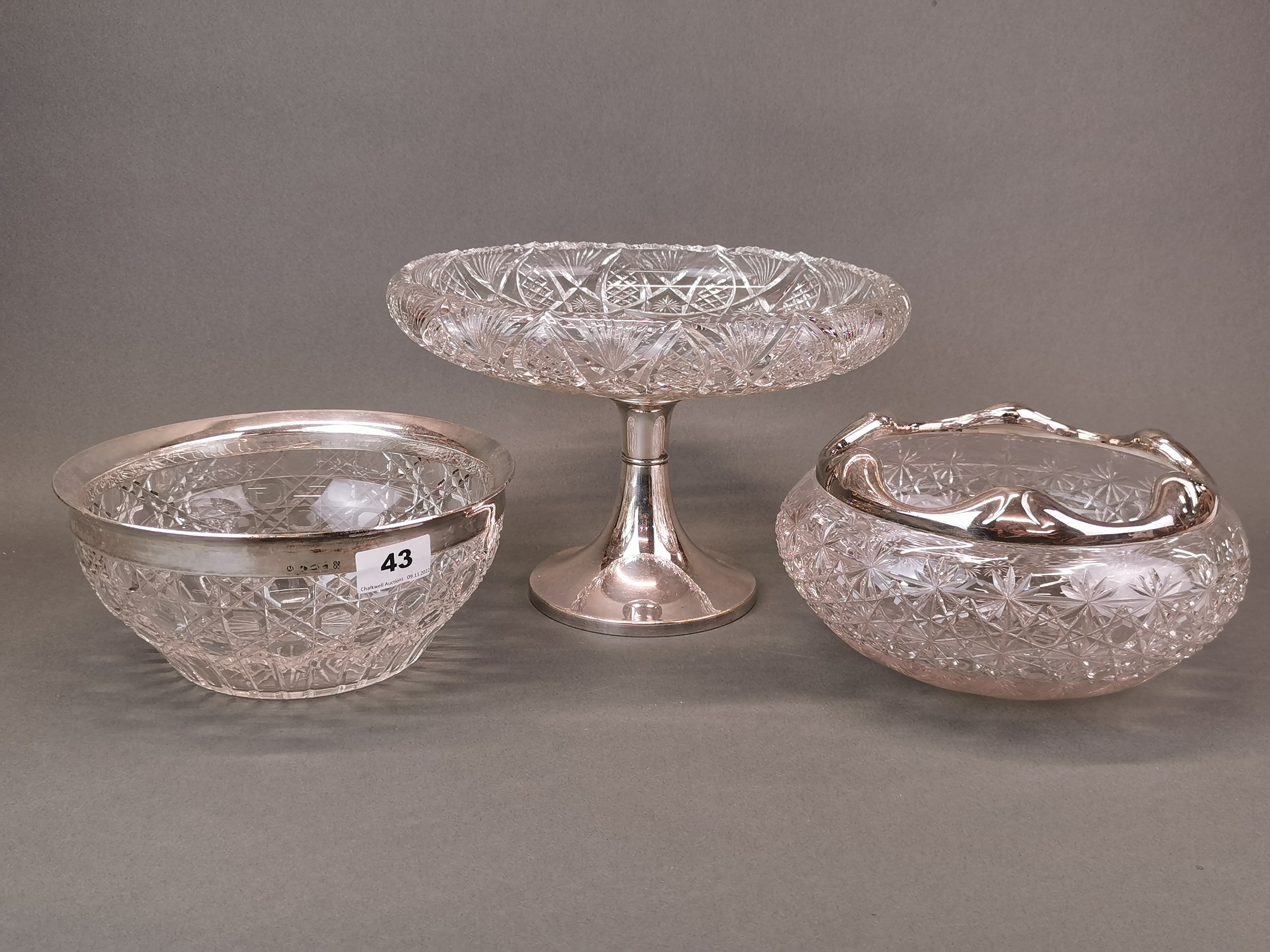 Two antique silver plate and cut glass fruit bowls, Dia. 23cm, together with a centrepiece.