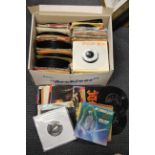 A large collection of pop rock and other single records.