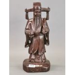 A Chinese carved hardwood figure of a lucky emperor, H. 41cm.