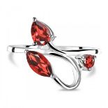 A 925 silver ring set with marquise and pear cut garnets, (N).