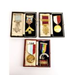 A group of silver and silver gilt Masonic medals.