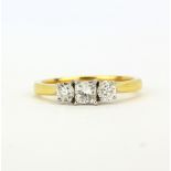 A hallmarked 18ct yellow gold ring set with a princess cut and two brilliant cut diamonds, approx.