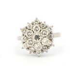 A white metal (tested 18ct gold) cluster ring set with brilliant cut diamonds, approx. 1.35ct total,