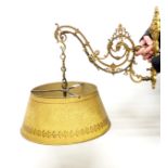 A gilt metal wall light bracket with 1930's fitting and Toleware shade, bracket 28 x 35cm, shade