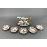 A Chinese porcelain sauceboat and stand with five dishes, spout to handle L. 19cm.