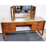 A mid century Uniflex figured walnut dressing table with three way mirror, 161 x 50 x 120cm.