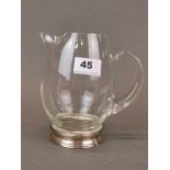 A stylish American Wallis sterling silver base and glass jug, H. 17cm.