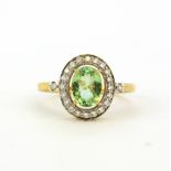 A hallmarked 18ct yellow gold ring set with a large oval cut green tourmaline, approx. 1.2ct, set