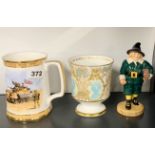 A Coalport porcelain commemorative beaker, with a Royal Doulton limited edition 233 / 2000 figure of