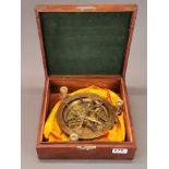 A cased brass sundial compass, box size 26 x 26 x 9cm.