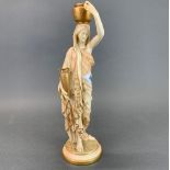 A lovely Royal Worcester classical figure of a woman carrying water, H. 37cm.