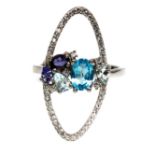 A 925 silver ring set with blue topaz, tanzanites and white stones, (R.5).