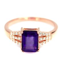 A rose gold on 925 silver ser with an emerald cut amethyst and white stones, (O).