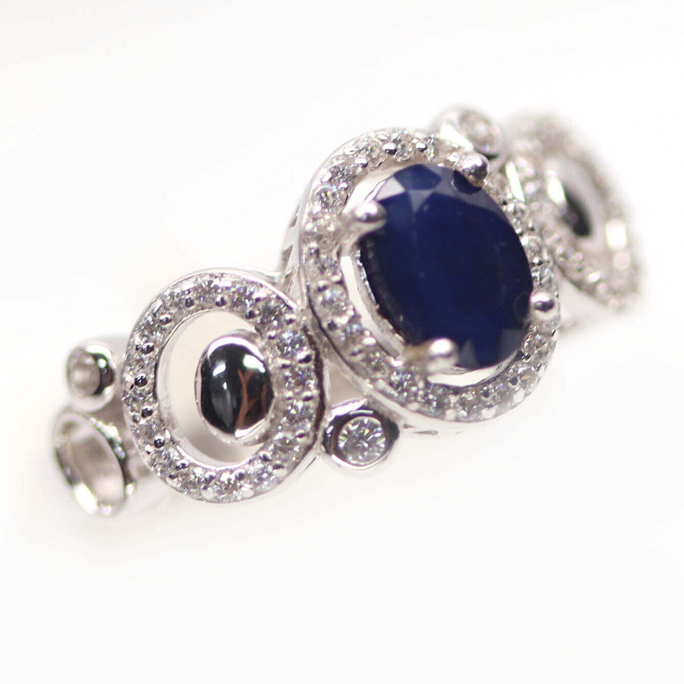 A 925 silver ring set with oval cut sapphire and white stones, (N). - Image 2 of 3