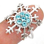 A 925 silver snow flake shaped ring set with blue topaz.