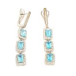 A pair of 925 silver drop earrings set with step cut blue topaz and white stones, L. 3.8cm.