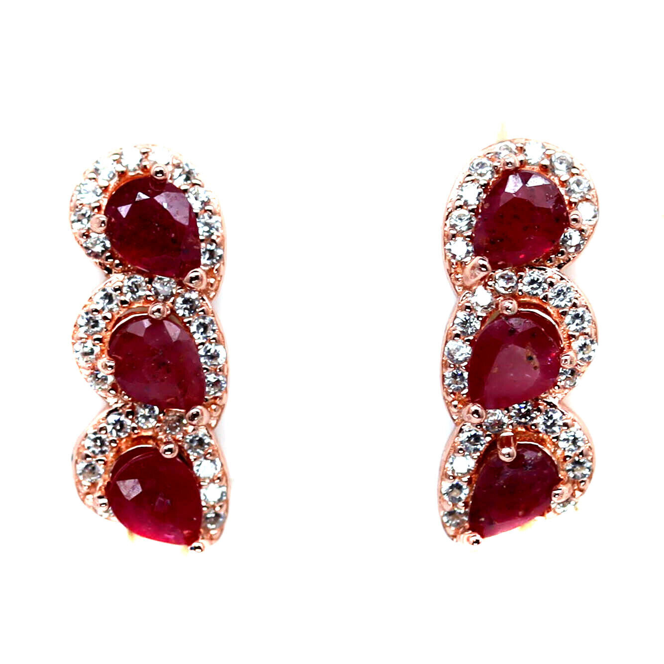 A pair of rose gold on 925 silver earrings set with three oval cut rubies and white stones, L. 1.
